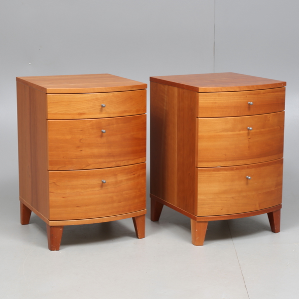 BEDSIDE TABLES by Rolf Fransson, a pair, model "Wave" by Voice, with convex front, veneered in cherry, three drawers, late 20th century / 